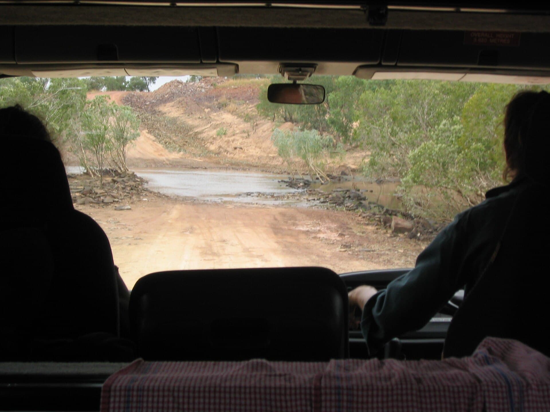 Gibb River Road winding through open tropical savanna and low Kimberley ranges.